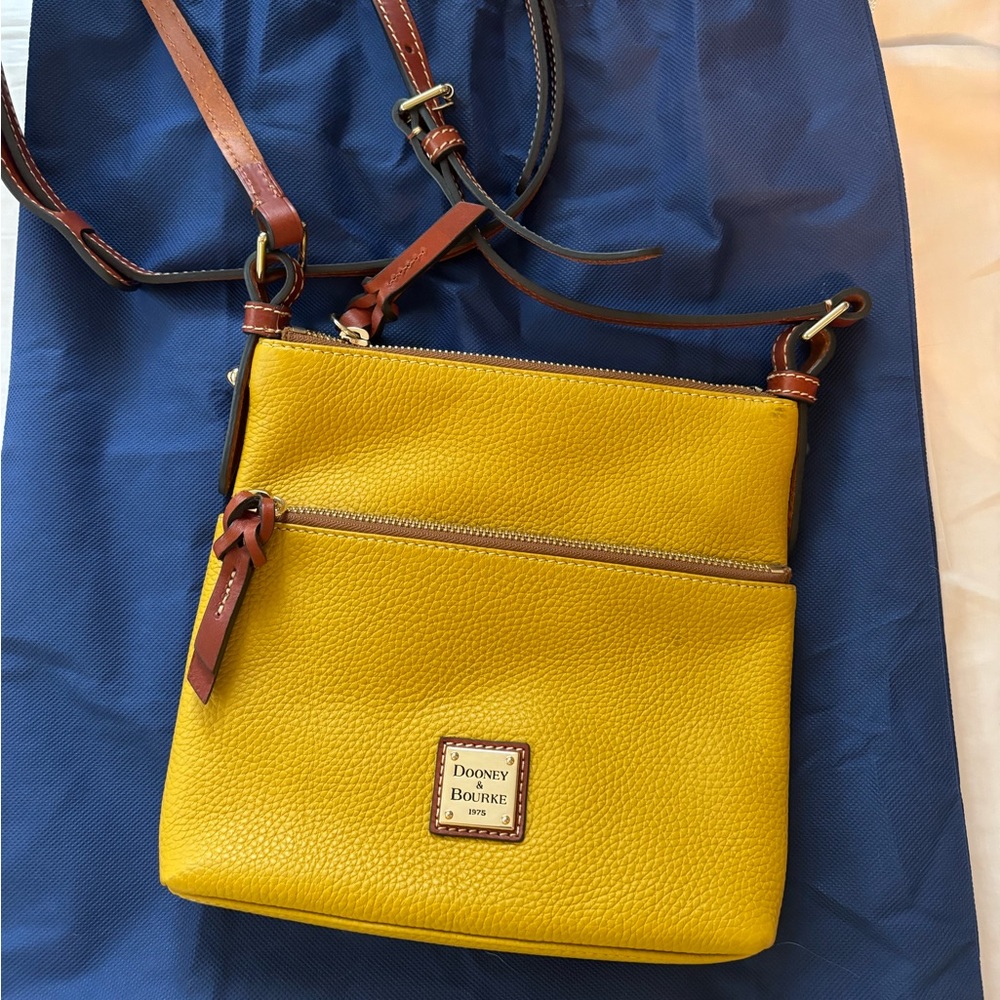 Dooney and Bourke pebble grain small everyday crossbody in yellow.